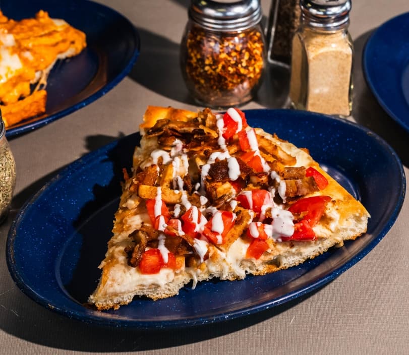 Cheese pizza on a wooden peel, ready to order