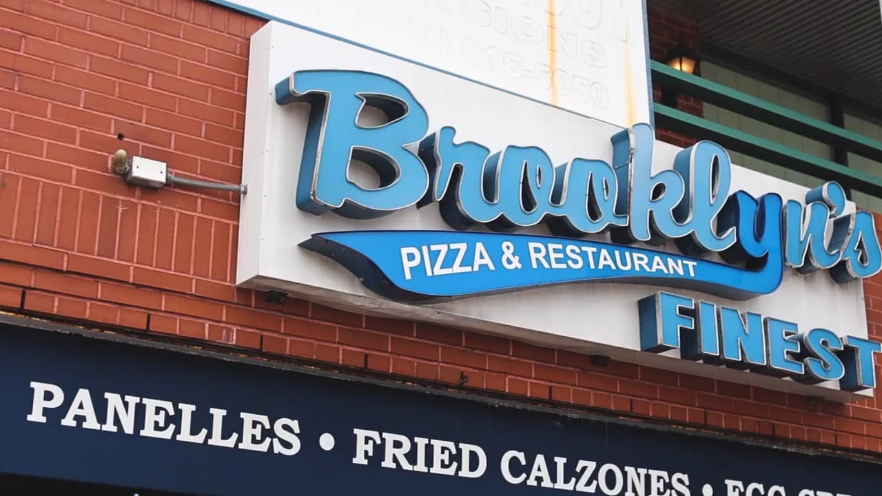 Cheese pizza on a peel at Brooklyn's Finest Pizza in Staten Island